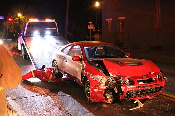 a red sports car that has been involved in a crash